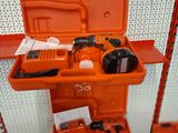 an orange tool box with tools on display in a store