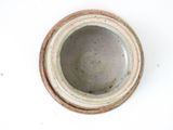 a close up of a bowl on a white surface