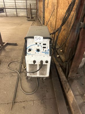 a machine that is sitting on the side of a building