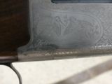 a close up of a gun with a engraved design on it