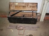 an old wooden chest with a metal latch on it