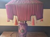 a lamp that is sitting on a table in a room