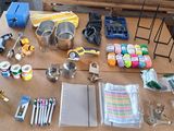 supplies laid out on a table in front of a painting easel