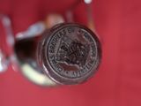 a close up of a wine bottle with a cork stopper