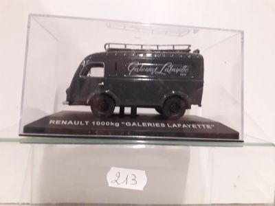 a black van in a glass case on a shelf