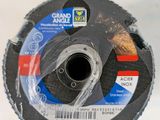 an image of a grinding disc on a table with a box in the background