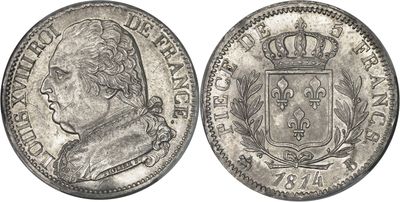 a silver coin with a crown on top of it