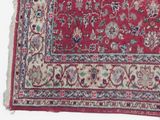 an image of a red rug with a floral design on it