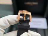 a person holding a watch in their hand