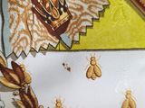 a picture of a close up of a tie with bugs on it