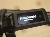 a close up of a bicycle with a display on the handlebar