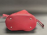 red leather purse with metal studs and zipper closure