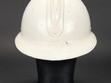 a white helmet on a mannequin head on a black background