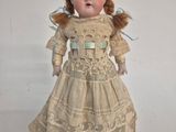 a small doll that is sitting on a table