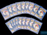 six packs of pokemon cards on a black background