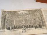an open book with a picture of a large group of people