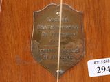a plaque on the door of a building with a price tag on it