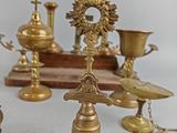 a lot of brass items that are on a table