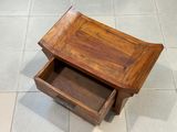 a small wooden table with a drawer underneath it