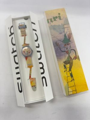 a box with a watch inside of it and a box with a watch inside of it