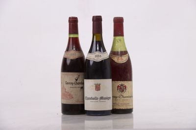 three bottles of wine sitting on top of a table next to each other