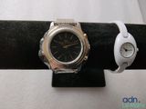 a watch and a watch bracelet on a black ring
