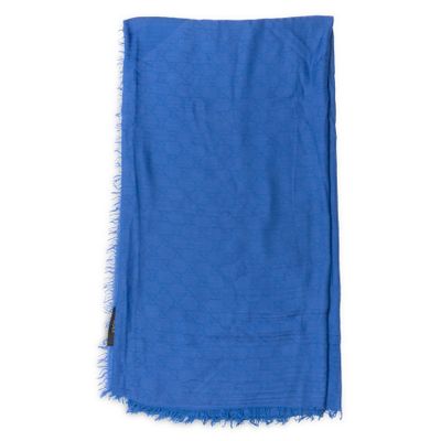 a close up of a blue scarf on a white background