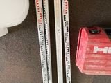 three skis that are sitting on the floor next to a pair of skis