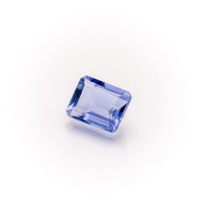 a blue sapphire stone on a white background