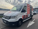 the van is parked on the side of the road in the parking lot