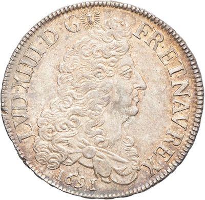 a silver coin with a woman ' s head on it