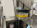 a kitchen with a sink and a refrigerator in it