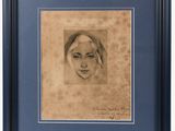a drawing of a woman ' s face in a blue frame