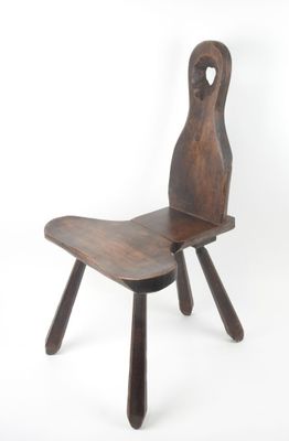 an image of a wooden chair sitting on top of a white floor
