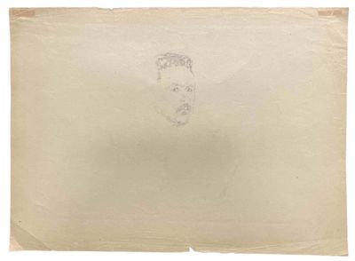 un morceau de papier sur lequel est dessiné le visage d'un homme