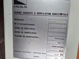 a machine that has a sign on it that says kremmlin