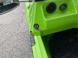 a close up of the inside of a green boat