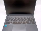 an open laptop computer sitting on top of a white table