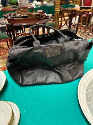 a large black bag sitting on a table in a room