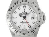 a close up of a wrist watch with a white dial