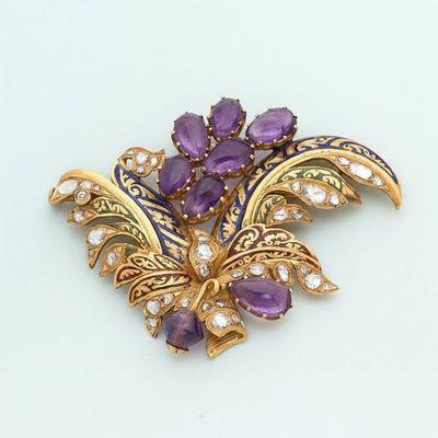 an image of a brooch with purple and white stones on a white surface
