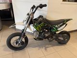a dirt bike that is sitting on the floor