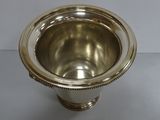 an image of a silver cup sitting on top of a table