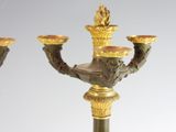 two candles that are sitting on top of a table