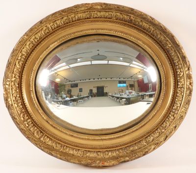 a mirror that is sitting on the wall in the room
