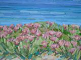 painting of pink flowers in the sand by the ocean