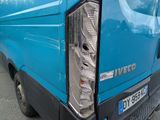 a close up of the tail light of a blue van