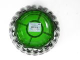 a green glass bowl with a label on it