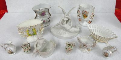 many different pieces of porcelain sitting on a table
