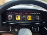 steering wheel of a car with a digital display on the dashboard
